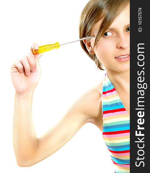 Portrait of a cute Caucasian blond girl with a nice colorful striped summer dress who is thinking and she is holding a screwdriver to her head. Isolated on white. Portrait of a cute Caucasian blond girl with a nice colorful striped summer dress who is thinking and she is holding a screwdriver to her head. Isolated on white.