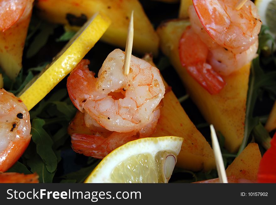 Close-up of sea food made of shrimps and lemon