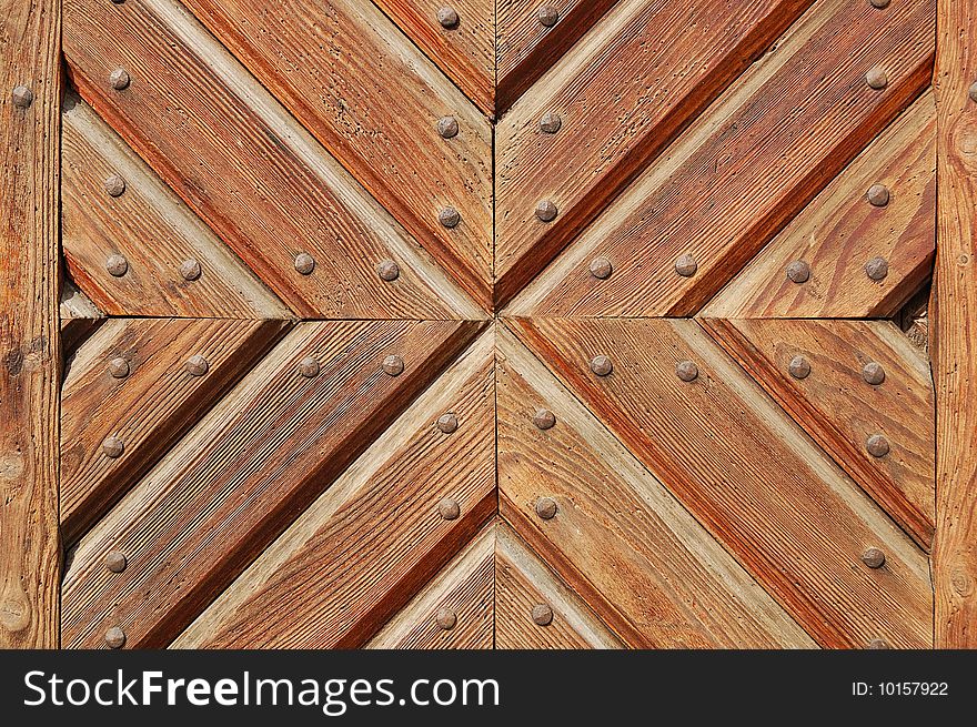 Fragment of durable wooden gate in old castle. Fragment of durable wooden gate in old castle