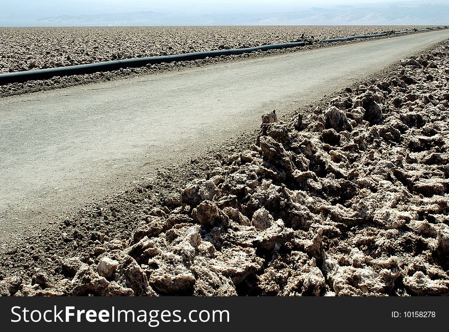 Road in Salar de Atacama - a big dry lake in Atacama Desert, Chile. Road in Salar de Atacama - a big dry lake in Atacama Desert, Chile.