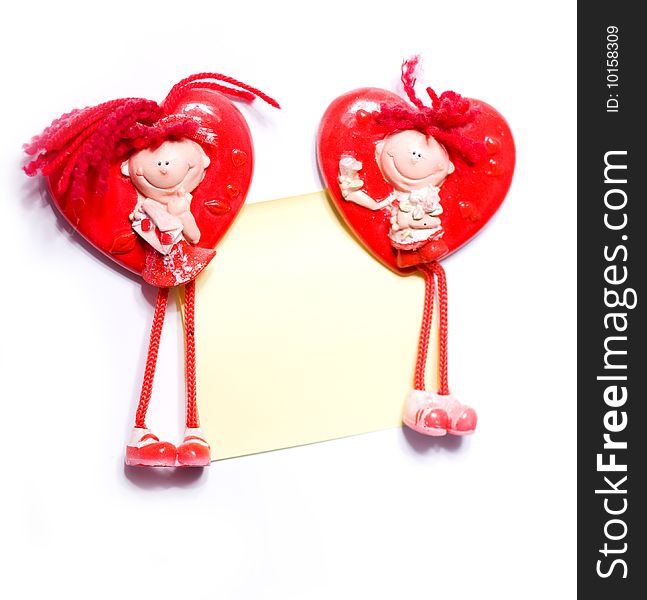 Two shape of heart toys of boy and girl with paper. Two shape of heart toys of boy and girl with paper