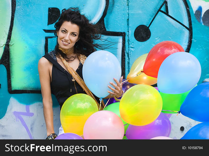 Woman with colorful balloons