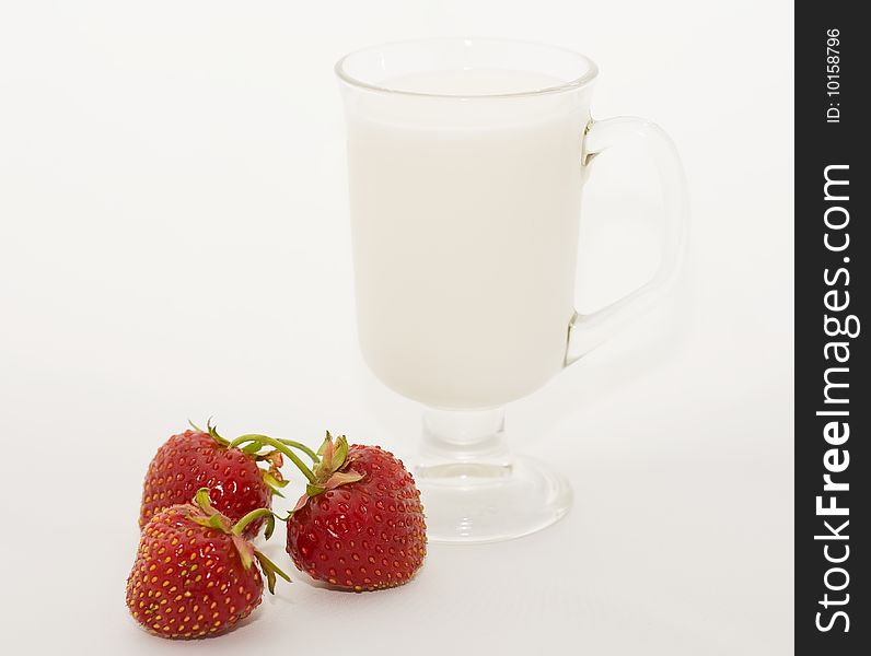 Glass cup milk berries of the strawberries. Glass cup milk berries of the strawberries