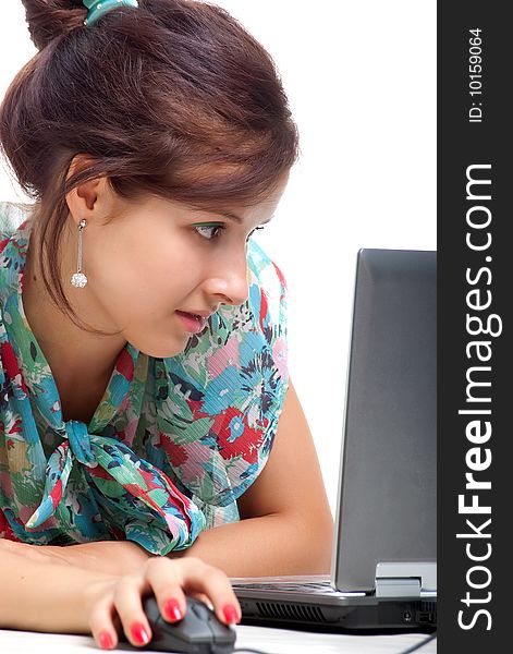 Cute young woman with laptop. Studio shot