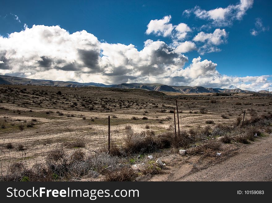 Rolling hills, a blue sky and clouds during the spring. Rolling hills, a blue sky and clouds during the spring.