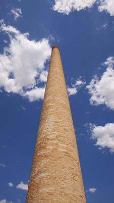 Old Brick Chimney Against The Blue Sky Stock Photography