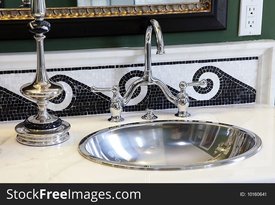 Modern bathroom with a luxurious sink and faucet. Modern bathroom with a luxurious sink and faucet.