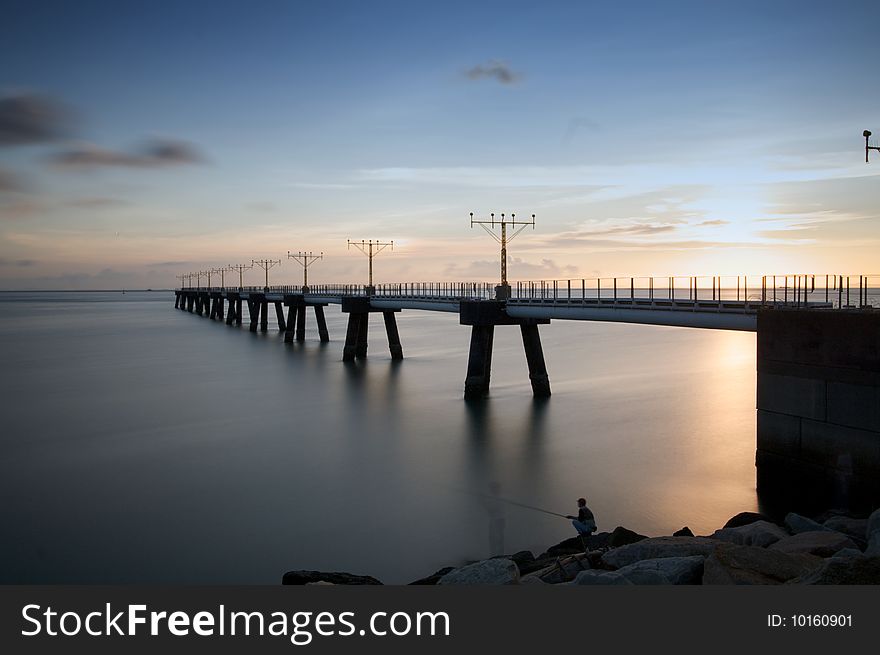 Sunset with a bridge with long exposure