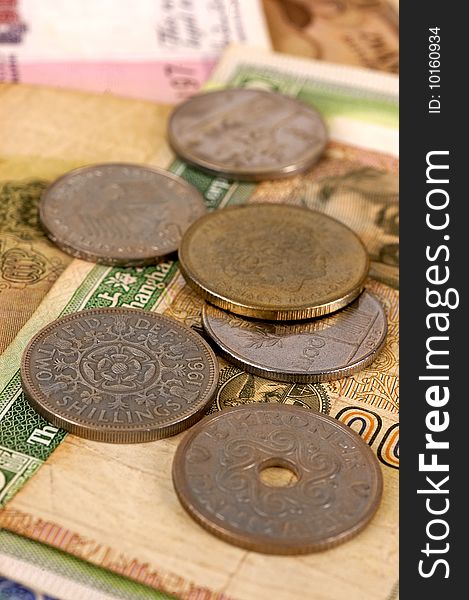 Foreign notes and coins with selective focus. Foreign notes and coins with selective focus