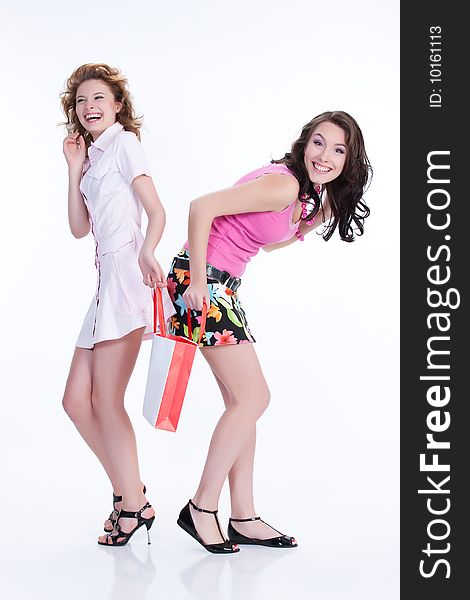 Young women with shopping bag laughing. Young women with shopping bag laughing