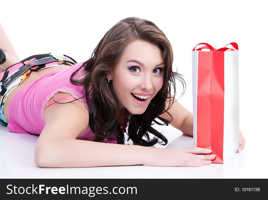 Young woman with shopping bag laughing. Young woman with shopping bag laughing