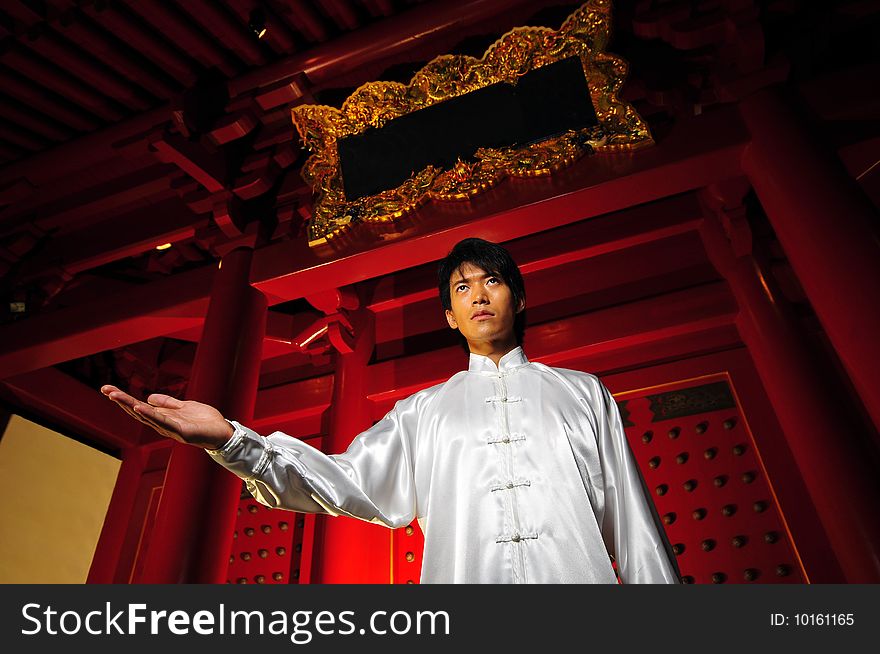 Young Asian Man In White Traditional Clothing In Oriental Theme. Young Asian Man In White Traditional Clothing In Oriental Theme
