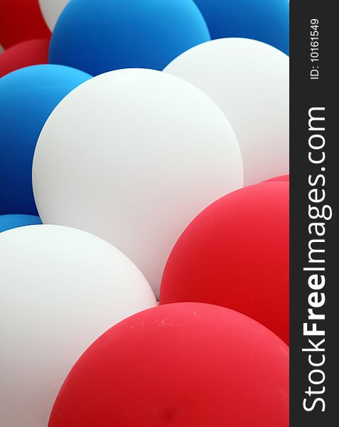Close up of red, white and blue balloons