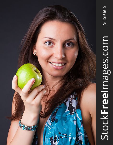 Beautiful girl with green apple