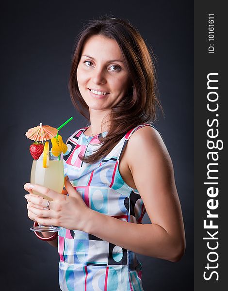 Beautiful girl with a fruit cocktail