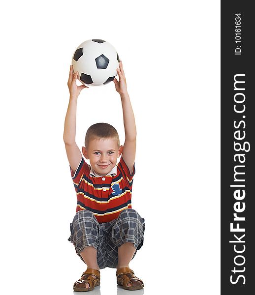 Young boy holding football in his hand. Young boy holding football in his hand