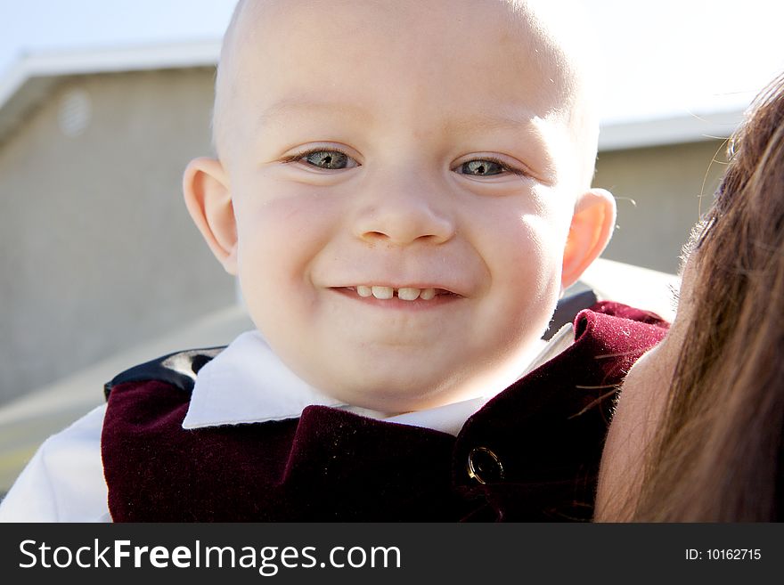 A Smiling Little Boy with big blue eyes