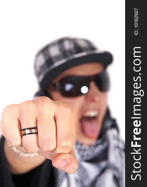 A young DJ is pointing at the camera and screaming. The focus is on his fist! Isolated over white. A young DJ is pointing at the camera and screaming. The focus is on his fist! Isolated over white.