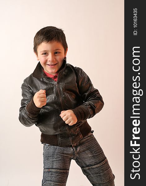 Elegant boy with brown jacket in studio. Elegant boy with brown jacket in studio