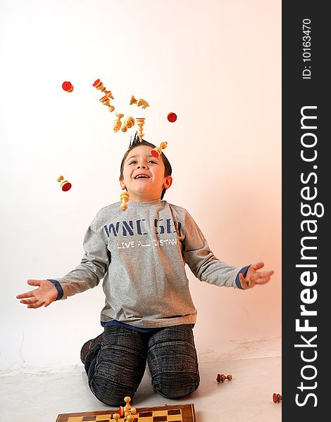 Child Playing With Chess Pieces