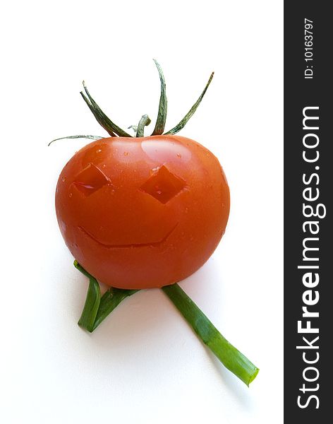 Funny tomato with green onions
