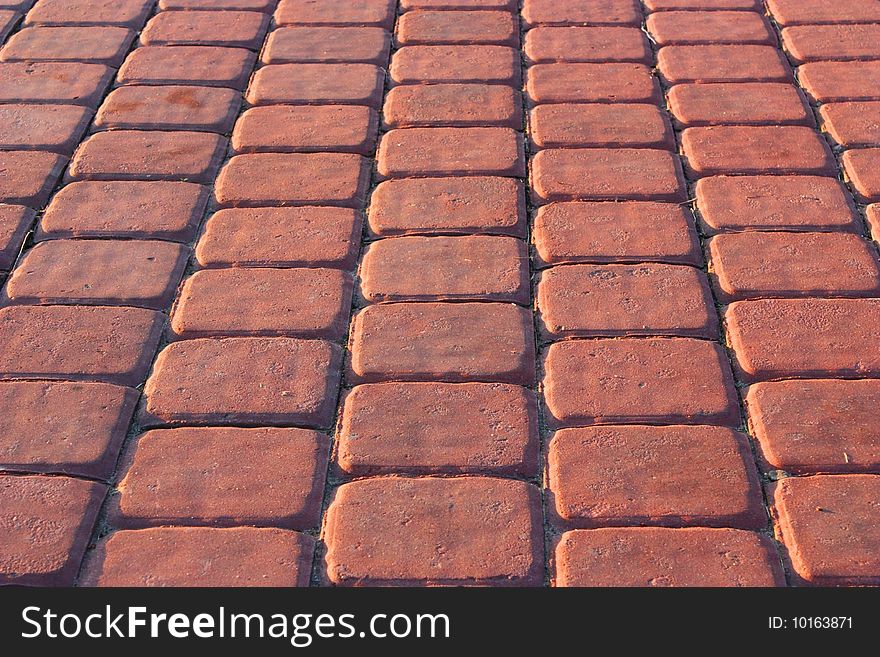 The path is laid out by a red brick or a tile. The path is laid out by a red brick or a tile.