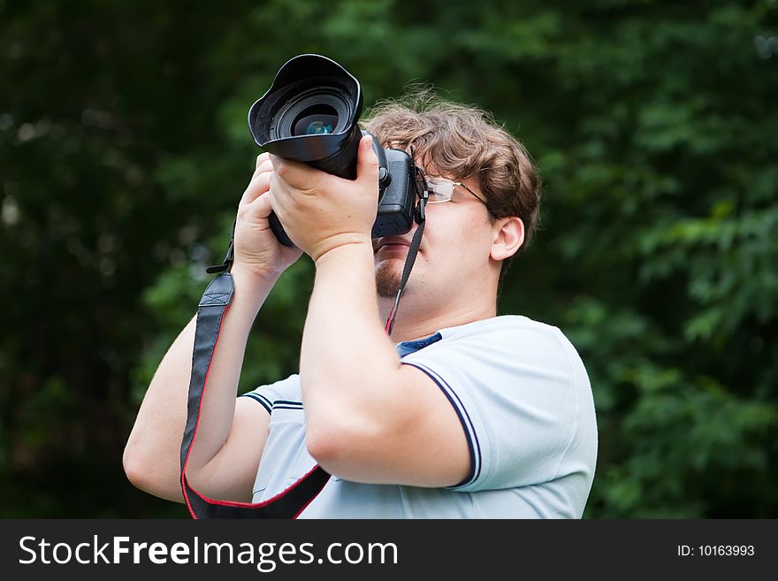 Man photographs the professional camera. Man photographs the professional camera