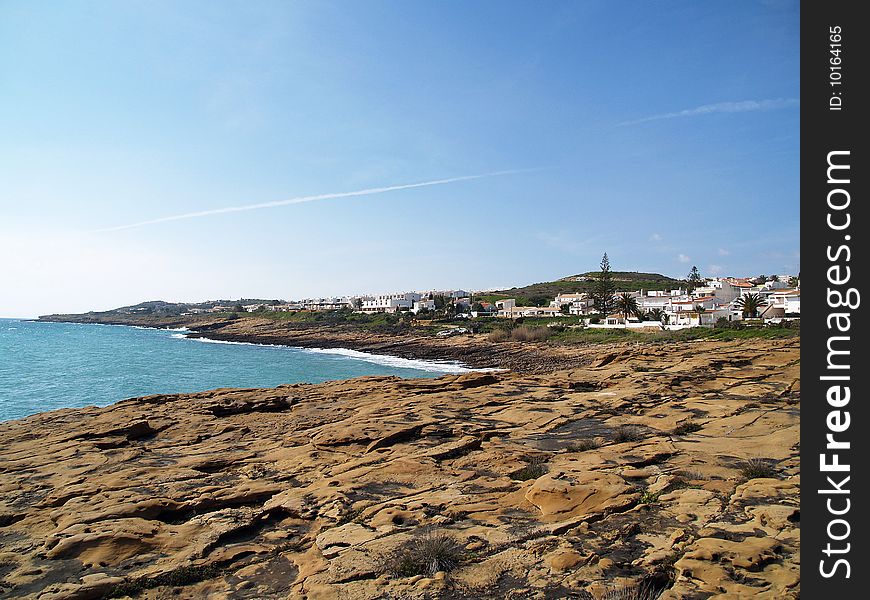 Small town of luz, in algarve, portugal. vire of the interesting beach rock formations. Small town of luz, in algarve, portugal. vire of the interesting beach rock formations