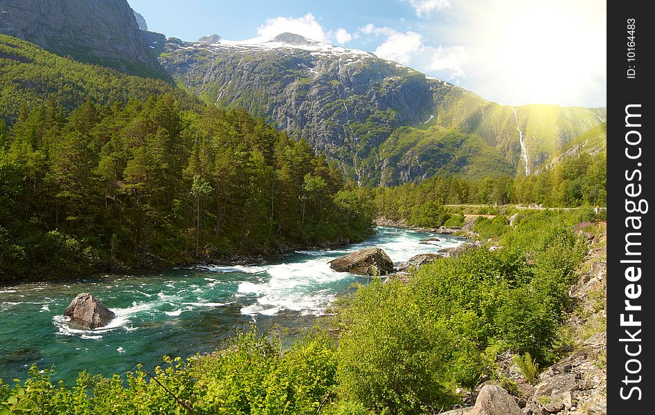 River and high mountains on bright sunny day. River and high mountains on bright sunny day