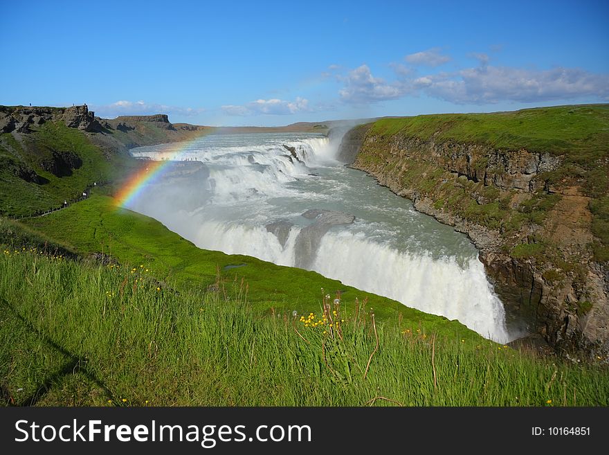 Famous Icelandic  waterfall with rainbow. Famous Icelandic  waterfall with rainbow