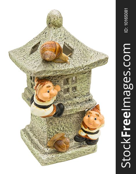 Decorative small house for a garden with gnomes and live snails on a white background