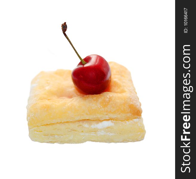 Isolated flaky cookie with cherry jam