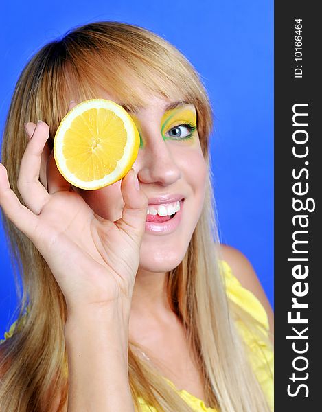 Blond girl with yellow lemon. Blond girl with yellow lemon