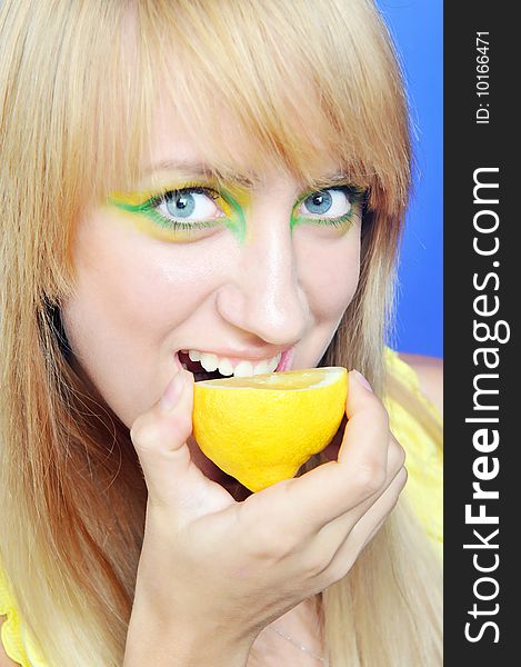 Blond girl with yellow lemon. Blond girl with yellow lemon