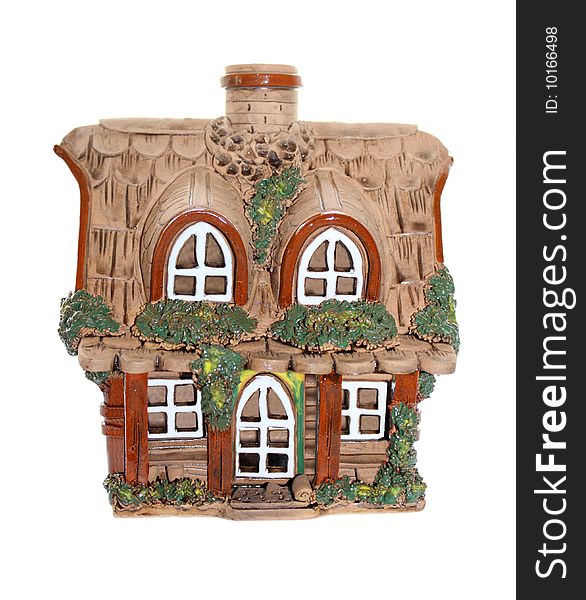 Isolated miniature clay house on white