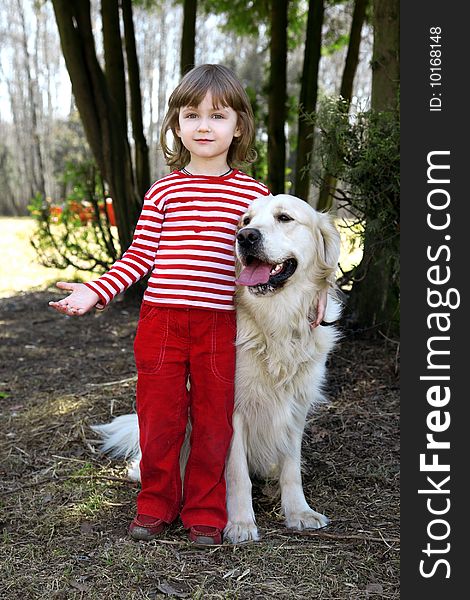 Friends - little girl with big retriever outdoor