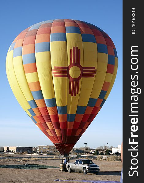 Hot air balloon on the ground with car