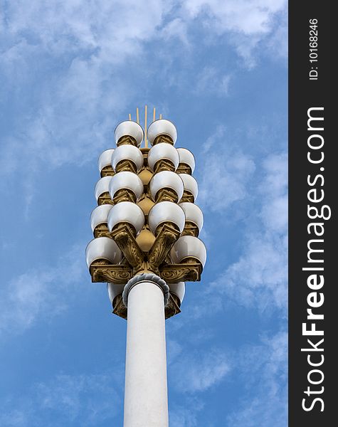 Lamp post on background sky, golden candelabrums