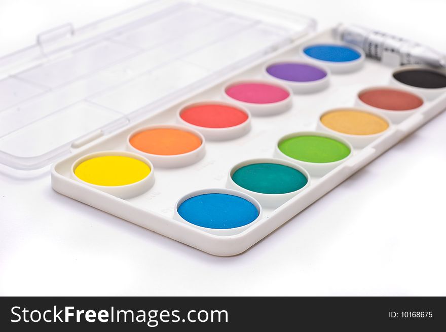 A box full of colorful gouache isolated on white