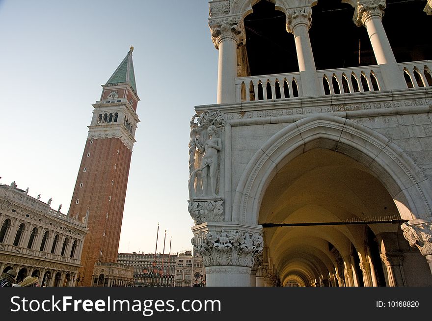 The archway of the doges palace and the campanille in st marks square in venice in italy. The archway of the doges palace and the campanille in st marks square in venice in italy