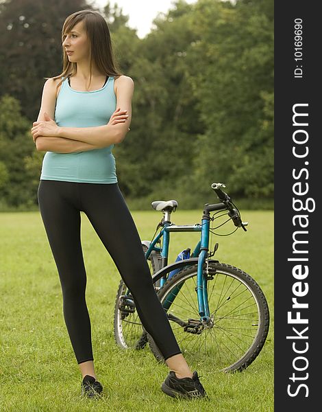 Active woman with a bike posing outdoor. Active woman with a bike posing outdoor