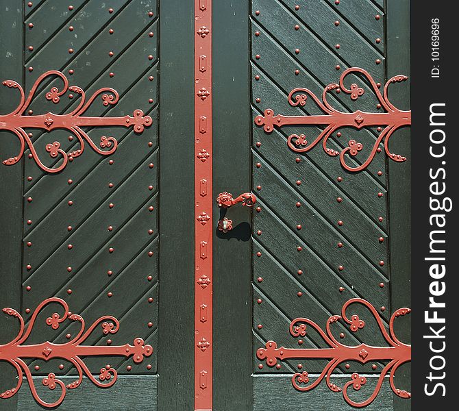 Closed green door with red ornament