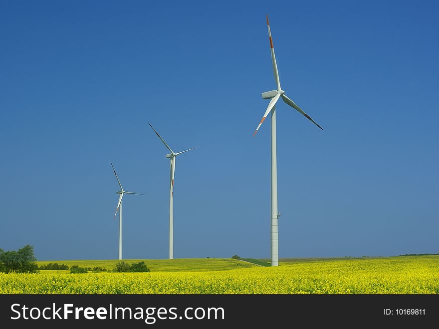 Wind turbine on blue sky background