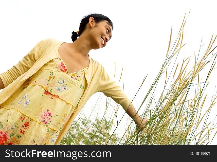 Lifestyle concept of a beautiful asian young woman enjoying a beautiful day outdoor. Lifestyle concept of a beautiful asian young woman enjoying a beautiful day outdoor