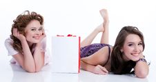 Young Emotional Women With Paper Bag Royalty Free Stock Images