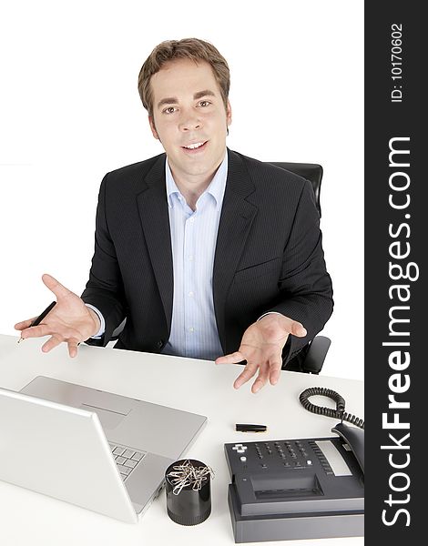 Picture showing young businessman being successful and sitting at his desk, motivating his audience. Isolated on white background. Picture showing young businessman being successful and sitting at his desk, motivating his audience. Isolated on white background.