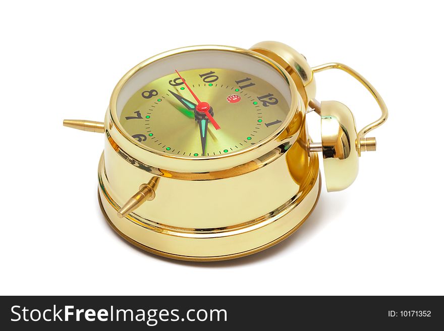 Beautiful gold alarm clock on white background