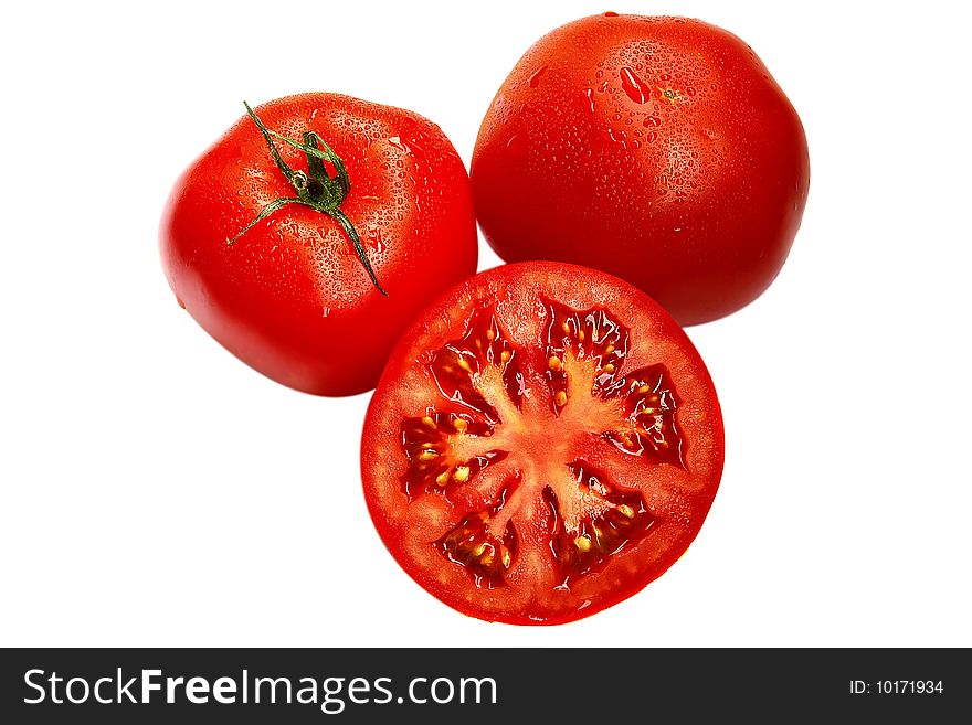 Two fresh tomato and a half on the white. Two fresh tomato and a half on the white