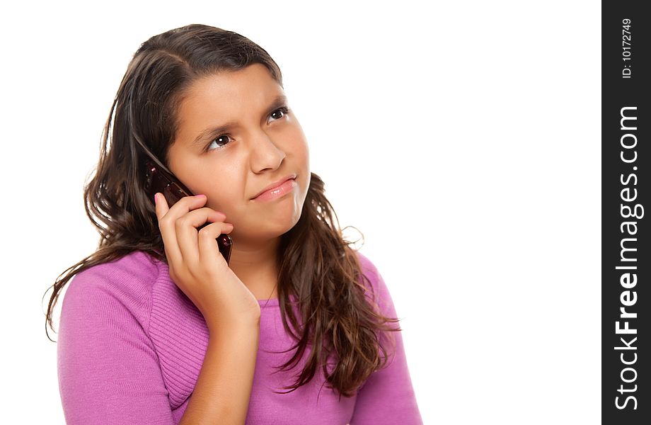 Frowning Hispanic Girl On Cell Phone Isolated on a White Background.