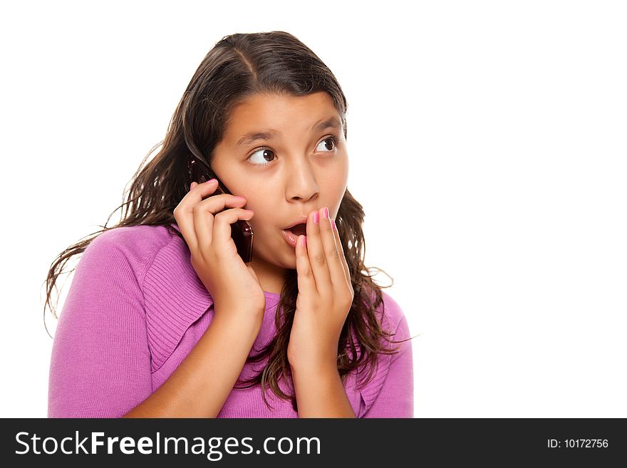 Shocked Pretty Hispanic Girl On Cell Phone Isolated on a White Background.